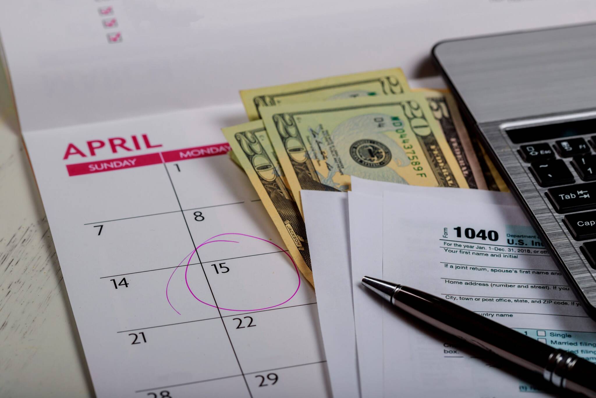 1040 Us Tax Form, Money And Calendar With U.s Dollars Money And Computer 1040 Us Tax Form, Money And Calendar With U.s Dollars Money And Computer