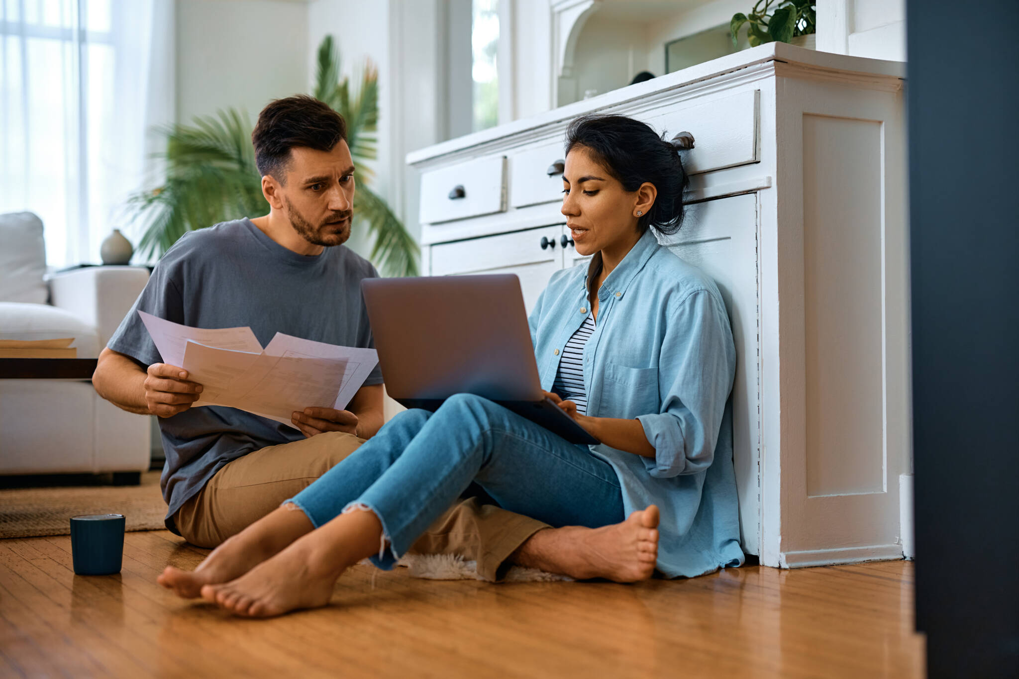Mid Adult Couple Analyzing Their Home Budget At Home.